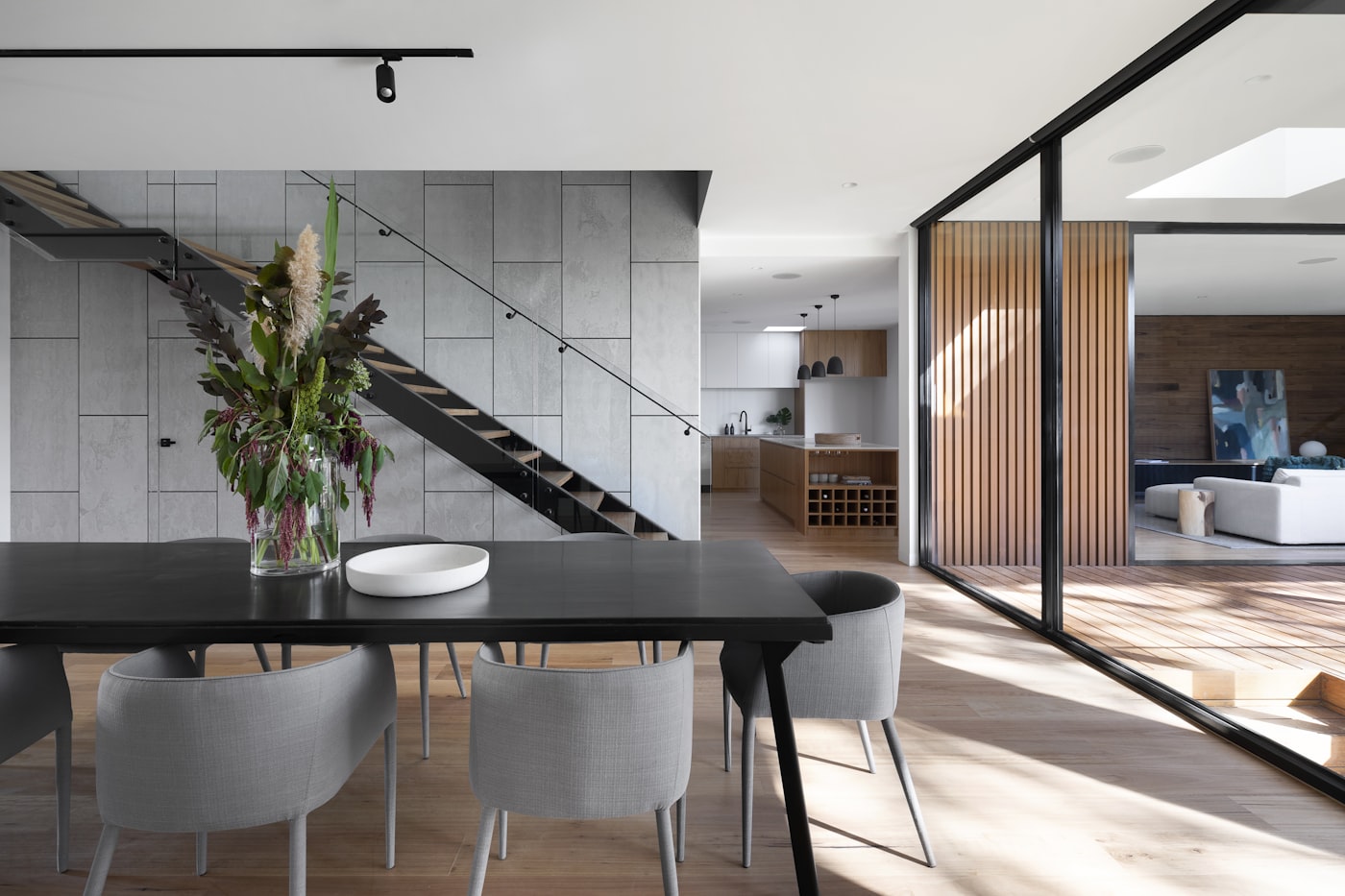 Open-plan interior renovation with natural light and timber finishes